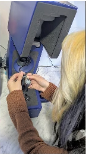 Hearing aid being verified on an Aurical FreeFit test rig