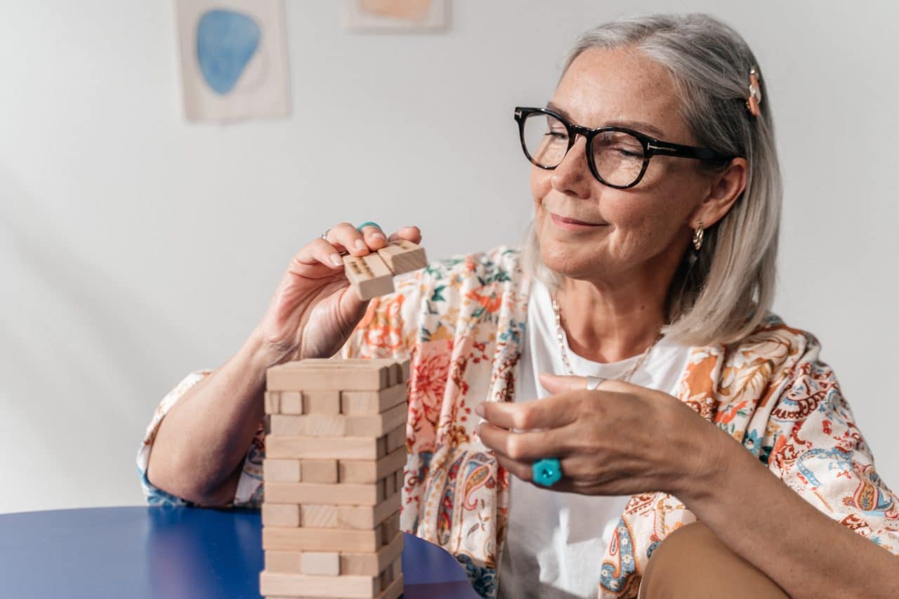 Senior woman working on a puzzle.