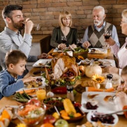 Happy family enjoying Thanksgiving dinner together